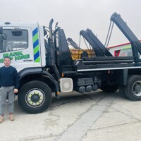 Man standing in front of lorry