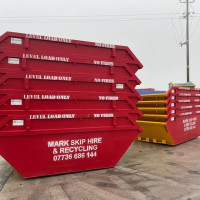 Side view of Mark Skip Hire skips ready for hire